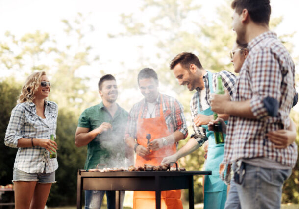 Friends camping and having a barbecue